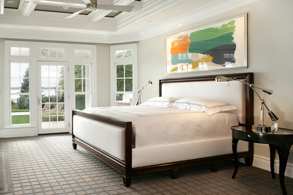 Photo of a traditional bedroom in Other with grey walls, carpet and no fireplace.