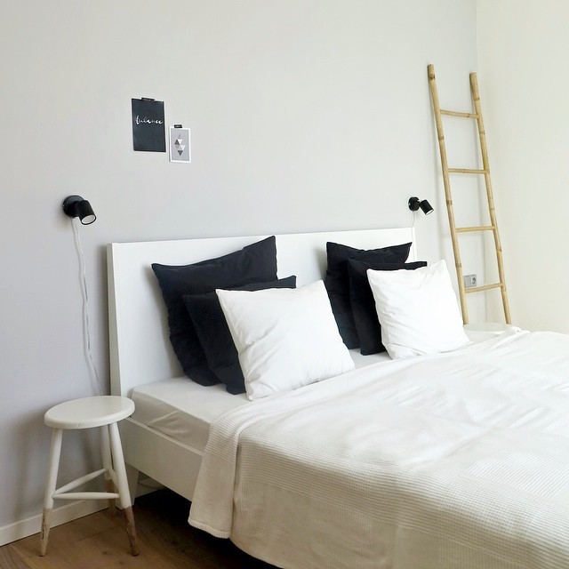 Example of a small trendy master light wood floor bedroom design in Other with gray walls