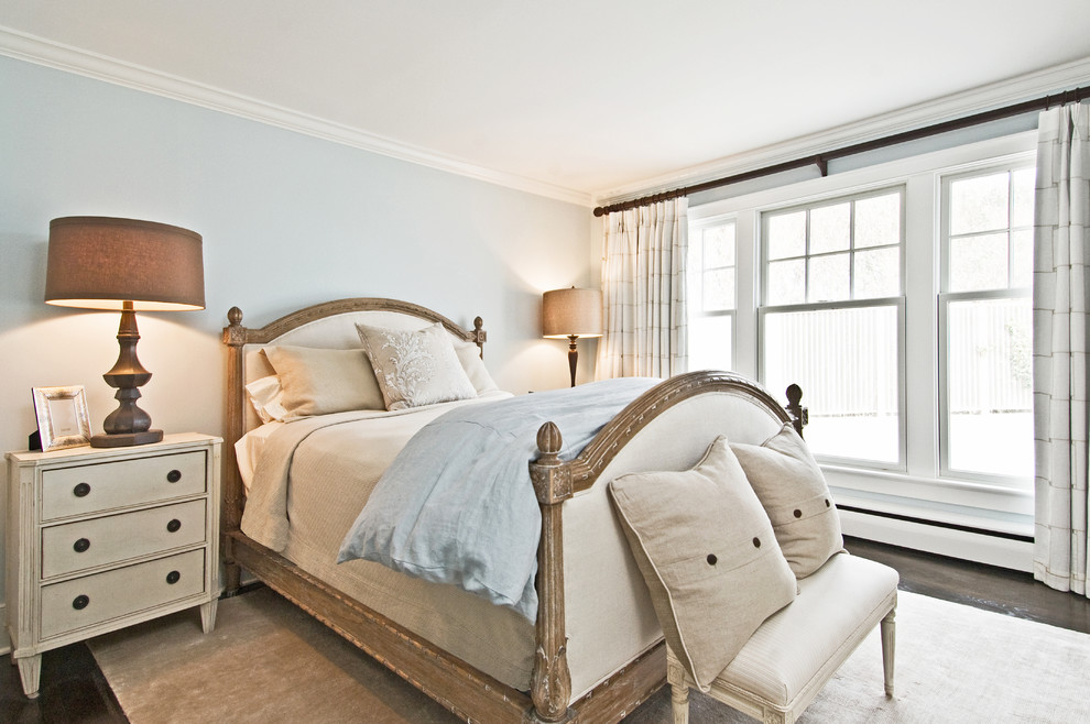 Example of an eclectic bedroom design in New York with blue walls