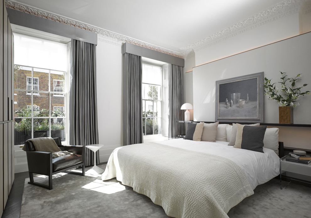Photo of a classic master and grey and white bedroom in London.