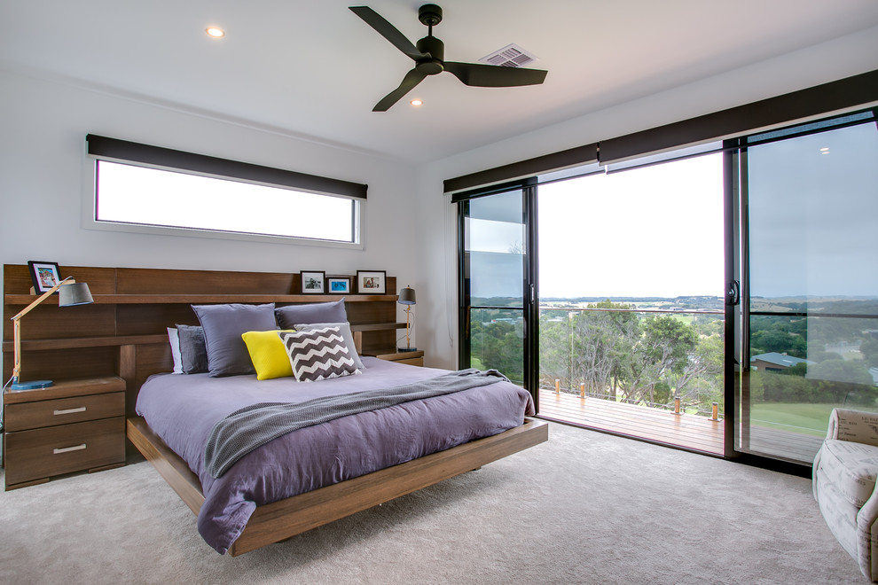 Coastal bedroom in Melbourne with white walls and carpet.