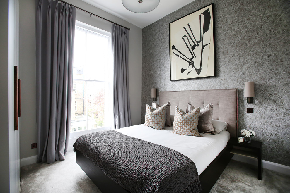 Idées déco pour une chambre avec moquette contemporaine avec un mur gris.