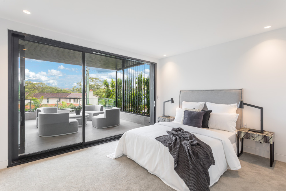 Example of a minimalist bedroom design in Sunshine Coast