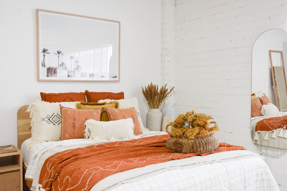 Inspiration for a large mediterranean bedroom remodel in Sunshine Coast with white walls