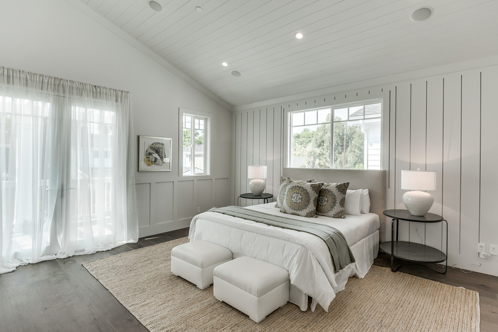 Inspiration for a large transitional master medium tone wood floor and brown floor bedroom remodel in Los Angeles with gray walls