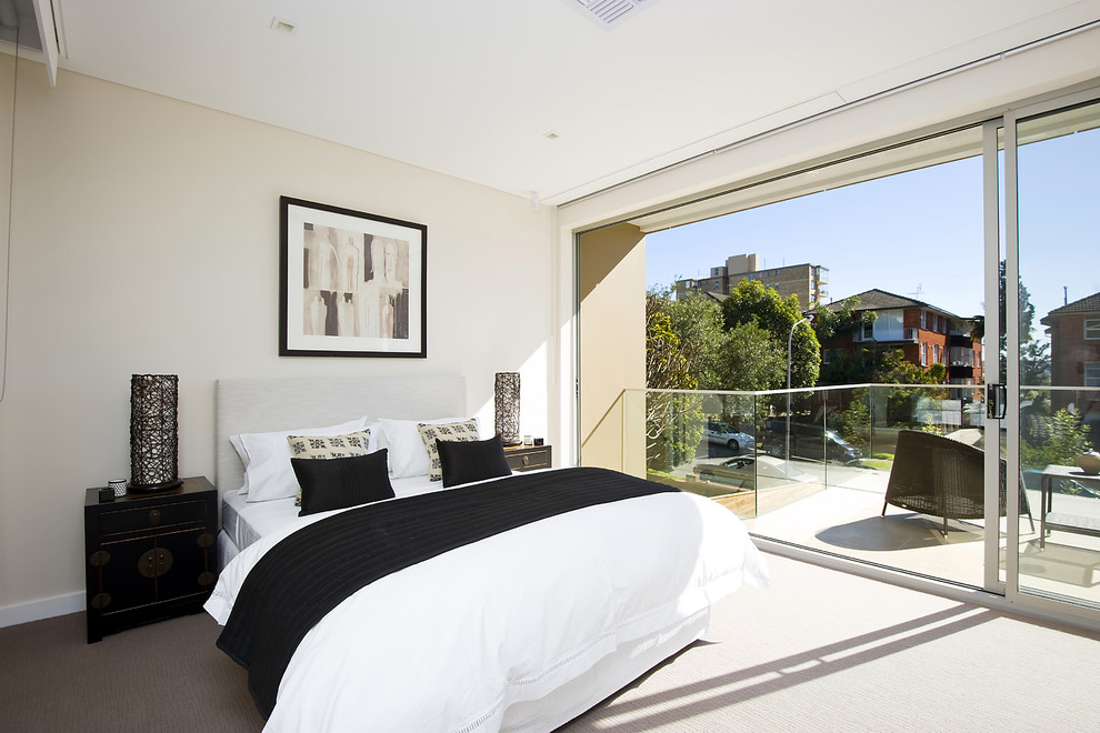 Contemporary master bedroom in Other with white walls, carpet and white floors.