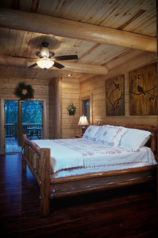 Diseño de dormitorio rural con suelo de madera oscura