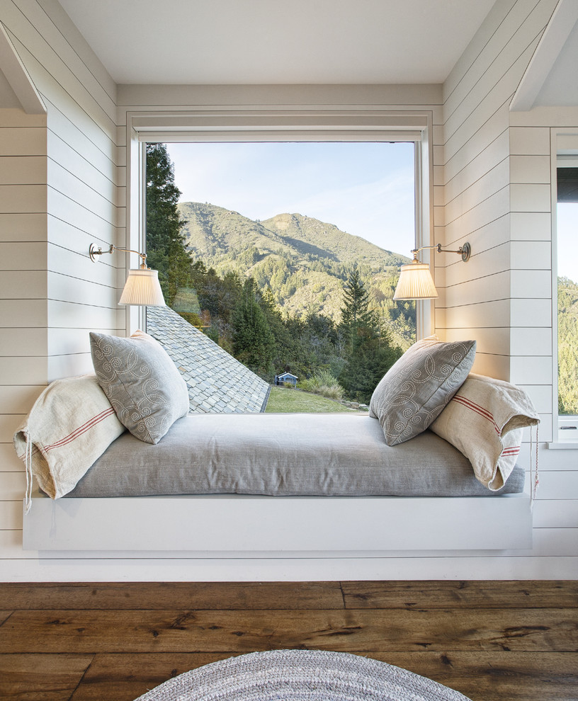 Bedroom - small rustic guest dark wood floor bedroom idea in San Francisco with white walls and no fireplace