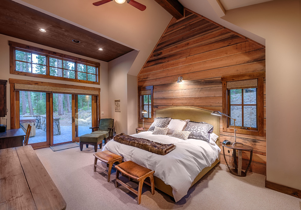 Photo of a rustic bedroom in Sacramento with carpet.