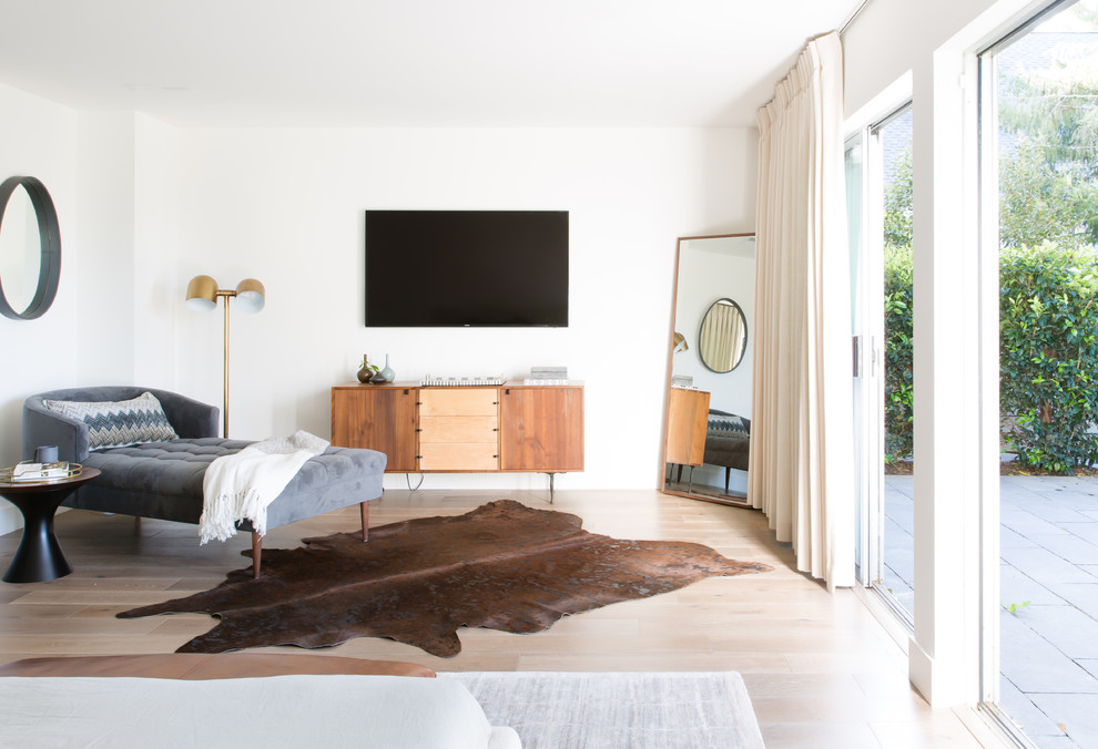 This is an example of a contemporary bedroom in Other with white walls, light hardwood flooring and beige floors.