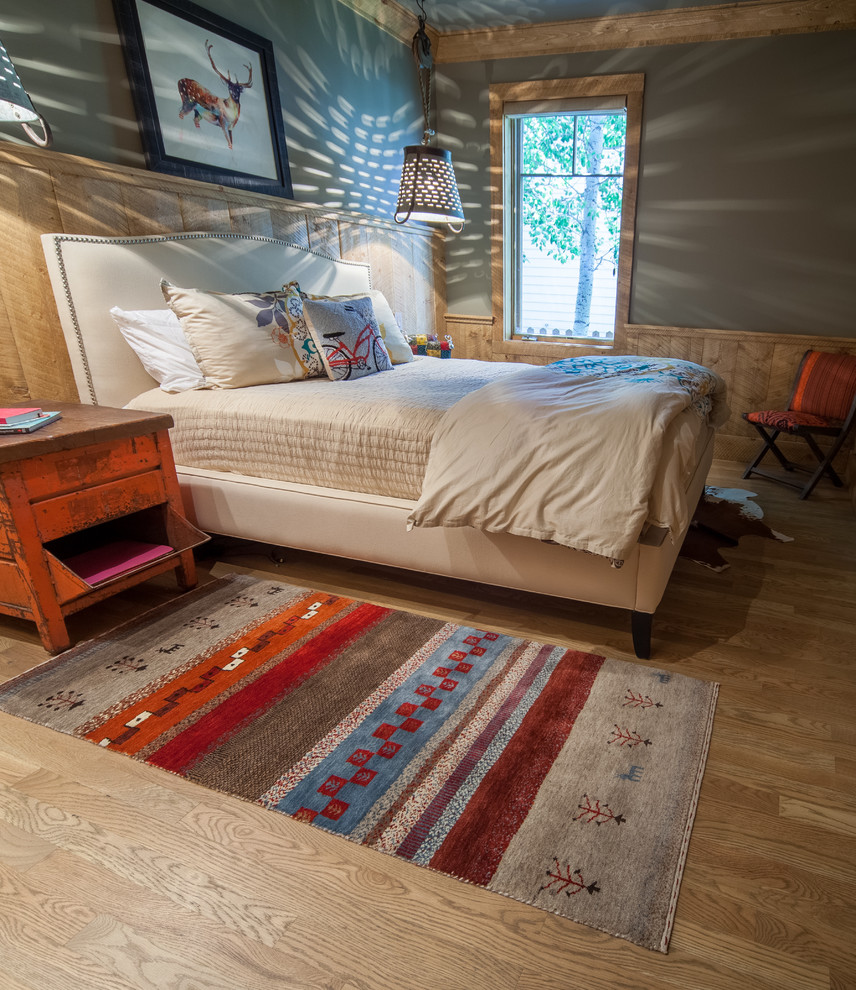 Inspiration for a mid-sized rustic guest light wood floor bedroom remodel in Denver with gray walls and no fireplace