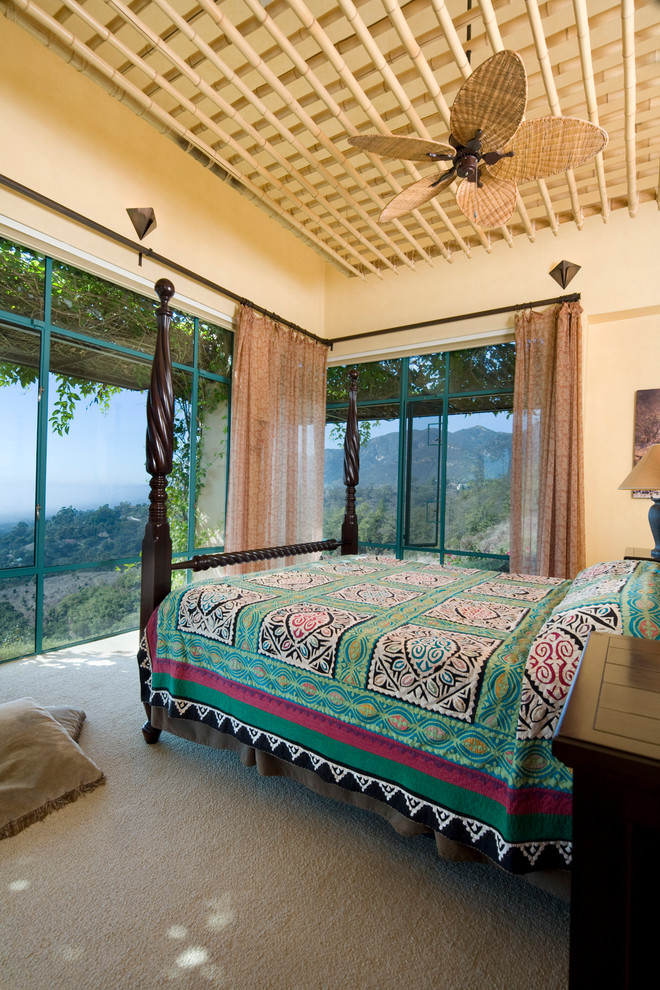 Inspiration for a large southwestern guest carpeted bedroom remodel in Santa Barbara with beige walls and no fireplace