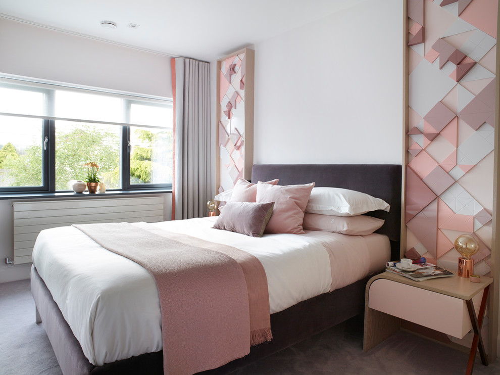 Design ideas for a medium sized contemporary grey and pink bedroom in London with grey walls, carpet, no fireplace and grey floors.