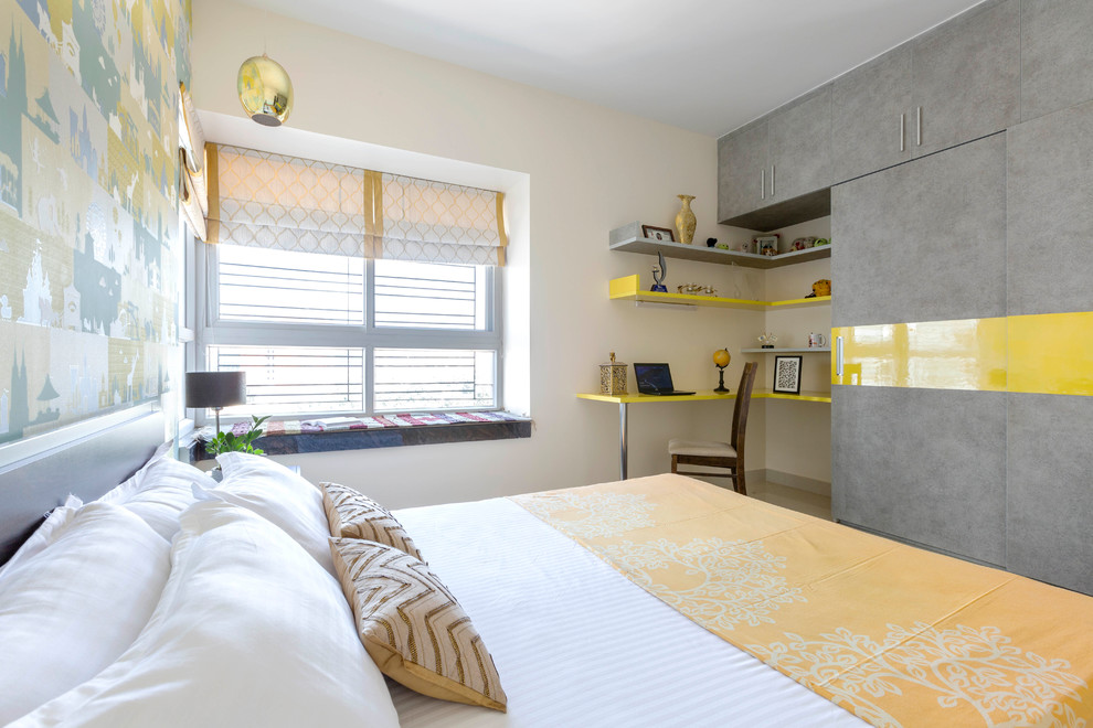 Exemple d'une chambre grise et jaune.