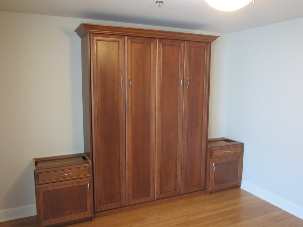 Example of a mid-sized classic guest light wood floor bedroom design in Other with white walls and no fireplace