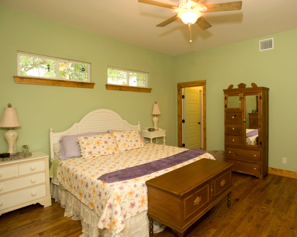 Bedroom - small craftsman dark wood floor and brown floor bedroom idea in Dallas with green walls and no fireplace