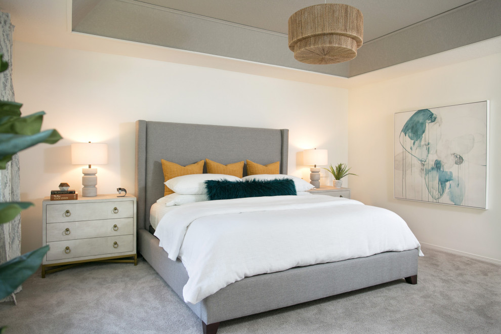 Medium sized contemporary master bedroom in Portland with white walls, carpet and grey floors.