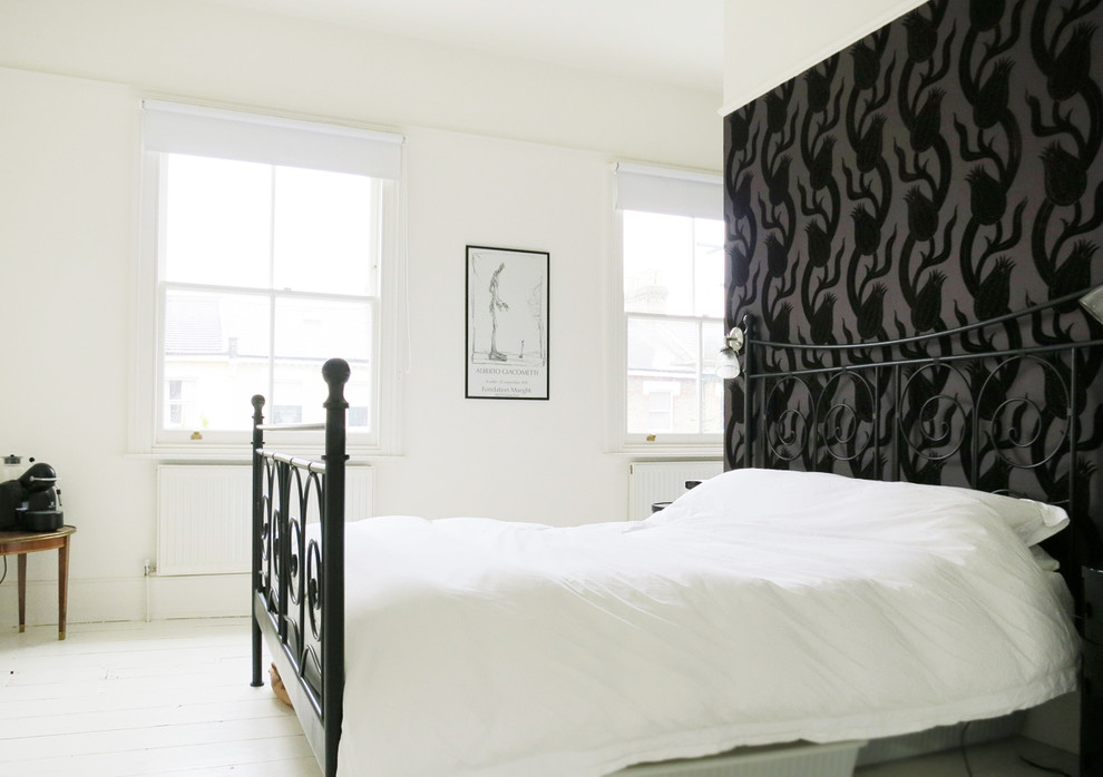 Eclectic white floor bedroom photo in London with white walls