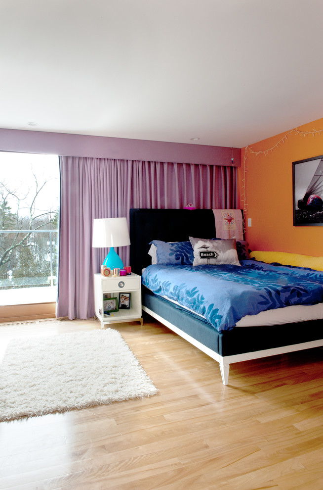 Bedroom - mid-sized contemporary guest light wood floor bedroom idea in Boston with orange walls