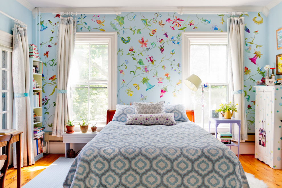 Inspiration for a timeless medium tone wood floor bedroom remodel in Boston with multicolored walls