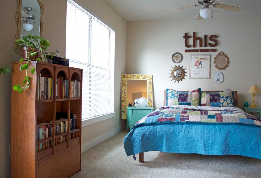Photo of an eclectic bedroom in Dallas with carpet.