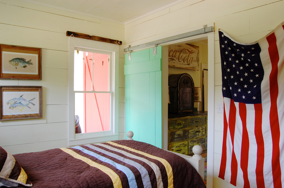 Example of a farmhouse bedroom design in New York with beige walls