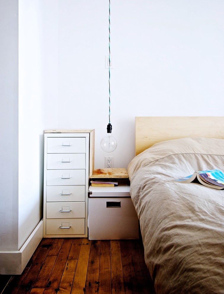 Bedroom - industrial bedroom idea in Toronto with white walls