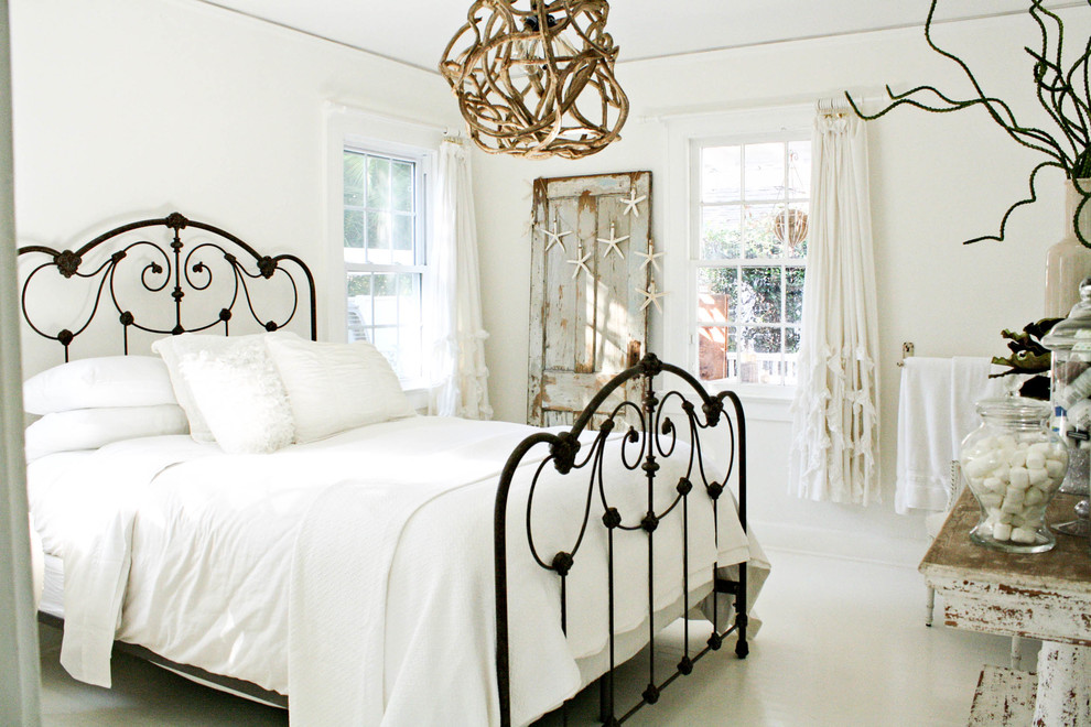 Cottage chic white floor bedroom photo in Tampa with white walls and no fireplace