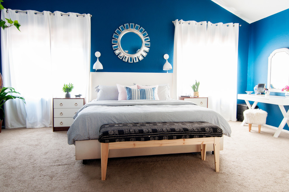 Example of a mid-sized eclectic master bedroom design in Los Angeles with blue walls