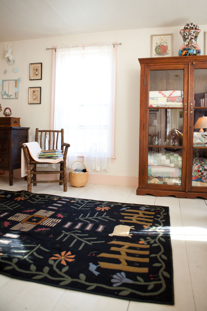 Inspiration for a country bedroom remodel in Burlington with beige walls