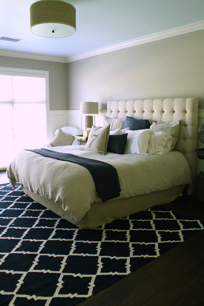 This is an example of a traditional bedroom in Tampa with beige walls.