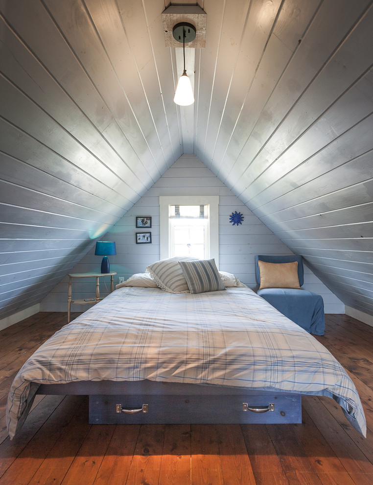 Bedroom - coastal medium tone wood floor bedroom idea in Other with white walls