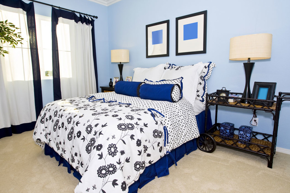 Photo of a medium sized farmhouse guest bedroom in DC Metro with blue walls, carpet, no fireplace and beige floors.