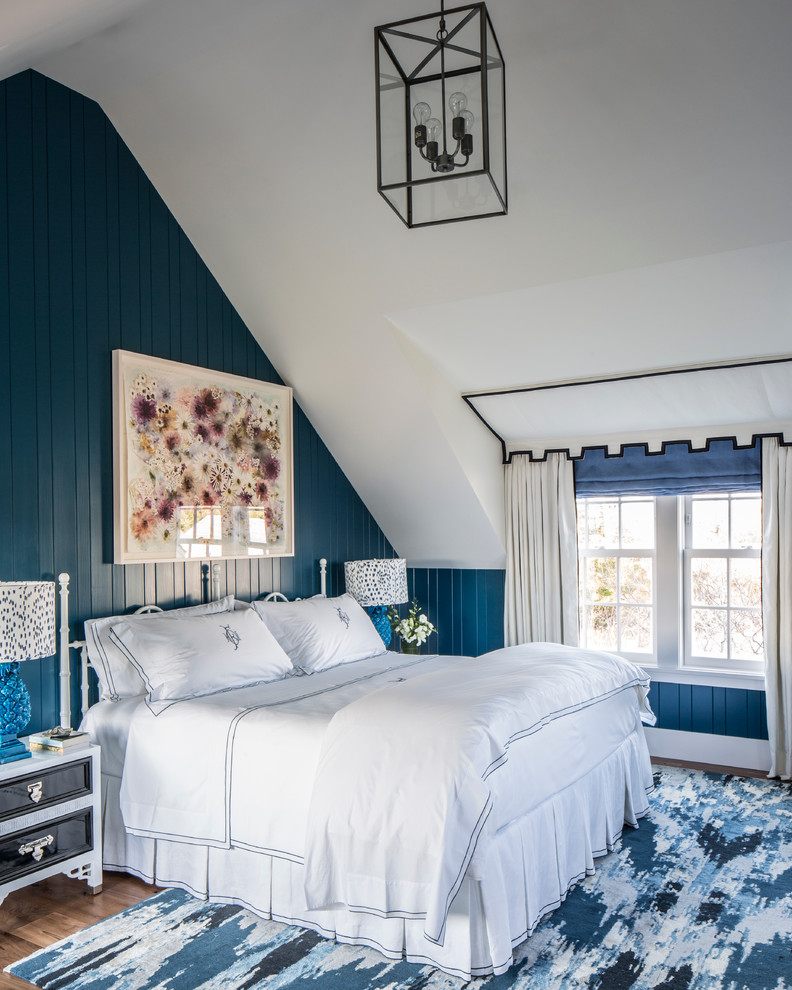 Inspiration for a medium sized coastal master bedroom in New York with medium hardwood flooring and blue walls.