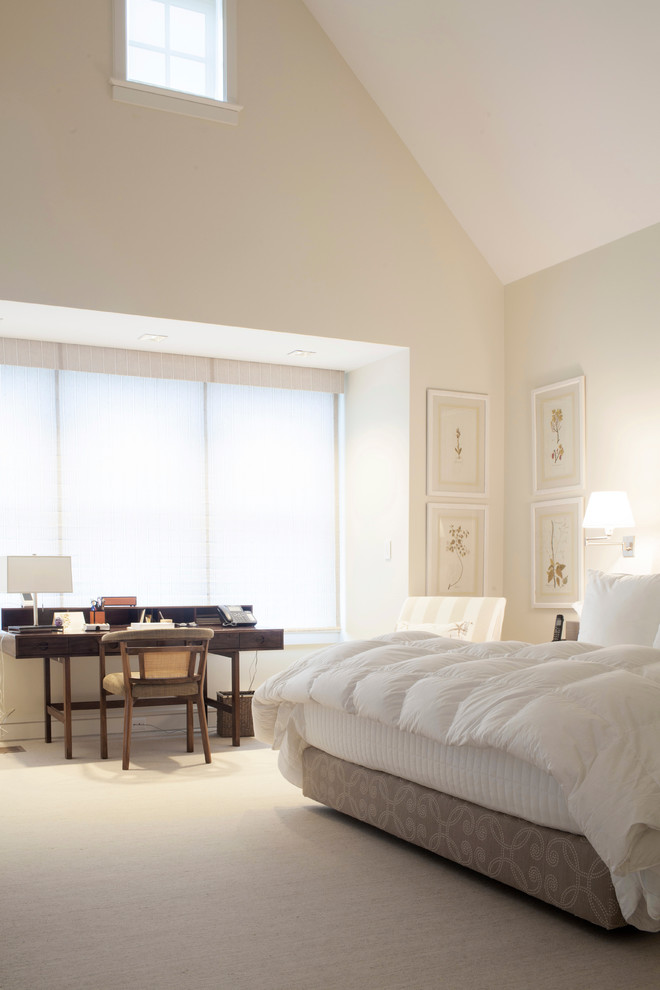 Example of a large country master carpeted bedroom design in Boston with beige walls and no fireplace