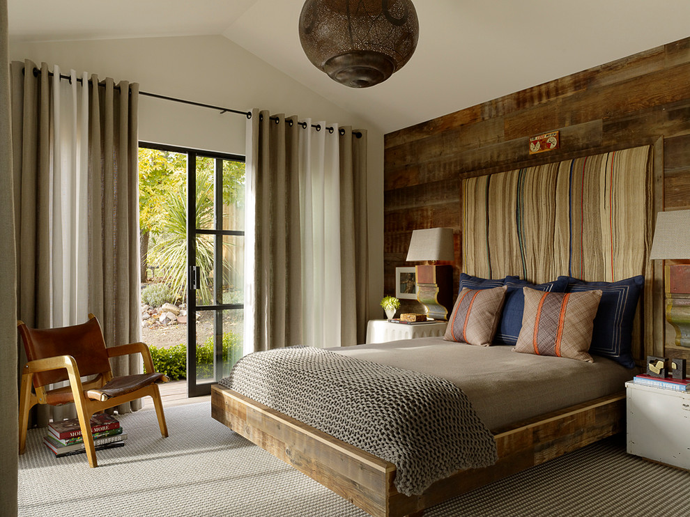 Design ideas for a classic guest bedroom in San Francisco with carpet and feature lighting.