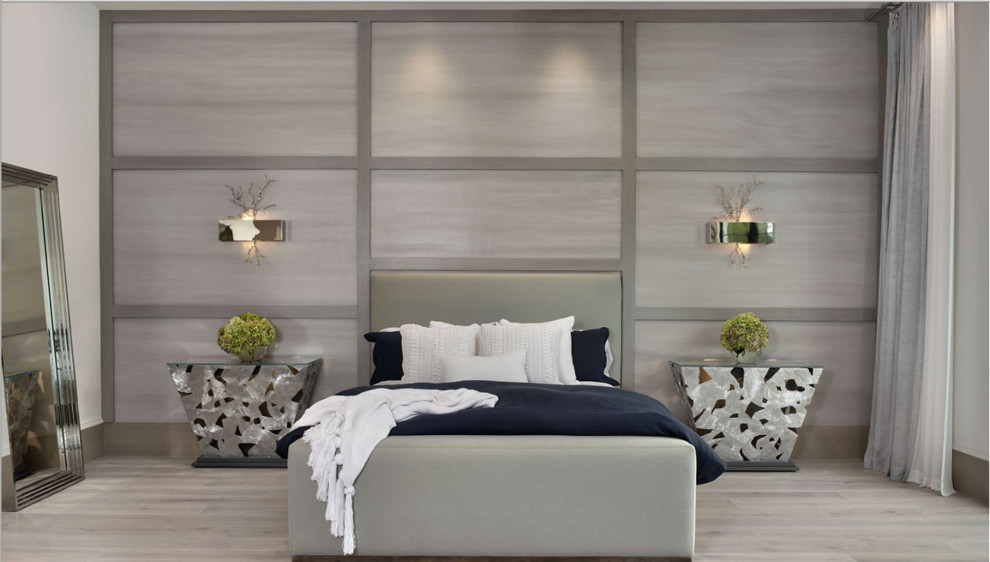 Large trendy guest light wood floor and beige floor bedroom photo in Miami with gray walls
