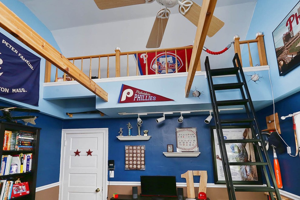 Example of a mid-sized eclectic loft-style bedroom design in Philadelphia with blue walls