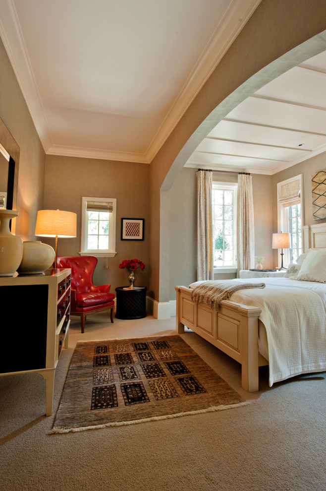 Photo of a large classic master bedroom in Nashville with brown walls and carpet.