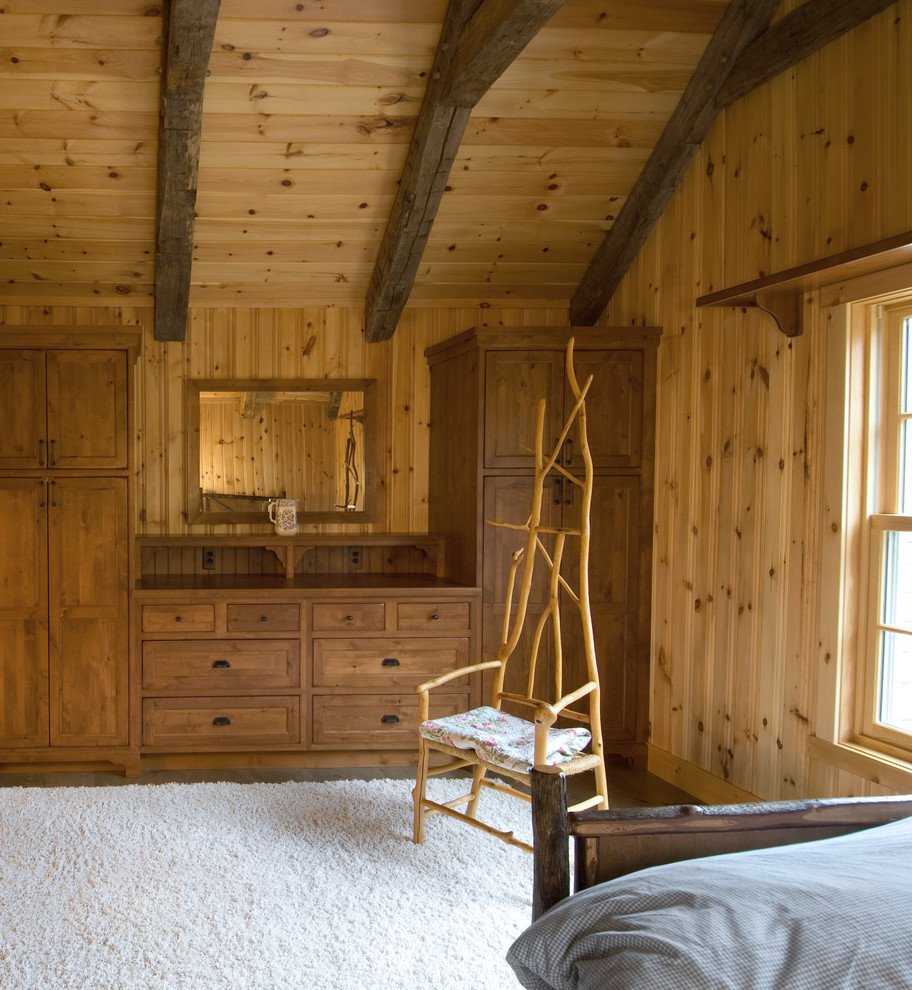 Inspiration for a rustic guest carpeted bedroom remodel in Minneapolis with brown walls