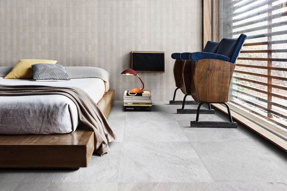 Inspiration for a contemporary guest bedroom in Sydney with beige walls, porcelain flooring and grey floors.