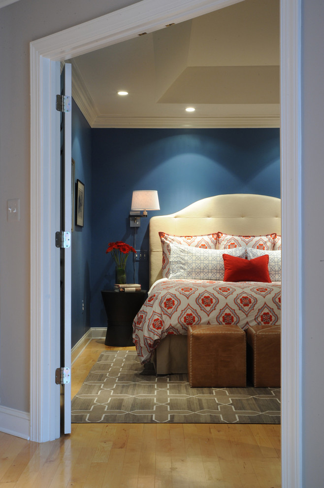 Transitional master light wood floor bedroom photo in DC Metro with blue walls