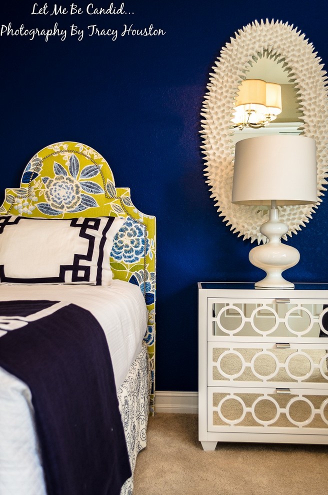 Small coastal guest bedroom in Miami with blue walls, carpet and beige floors.