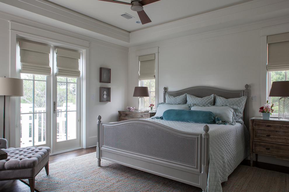Large beach style master dark wood floor bedroom photo in Jacksonville with white walls and no fireplace