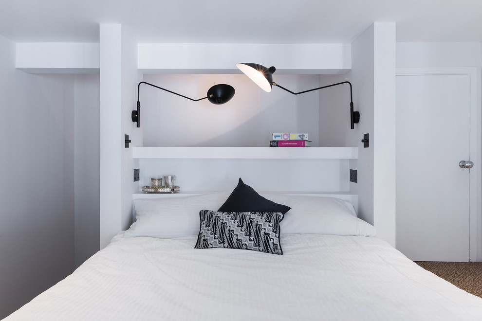 Example of a trendy bedroom design in London with white walls