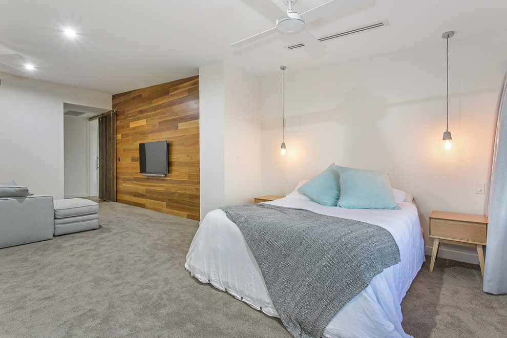 Design ideas for a contemporary bedroom in Brisbane with carpet.