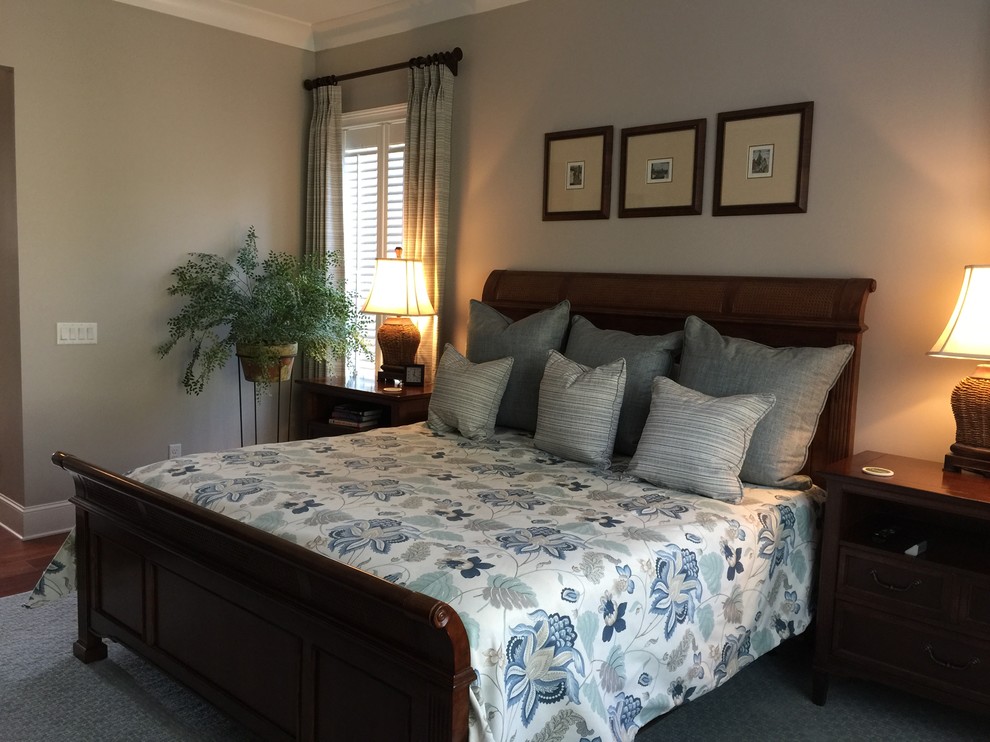 Inspiration for a medium sized classic master bedroom in Atlanta with beige walls and medium hardwood flooring.