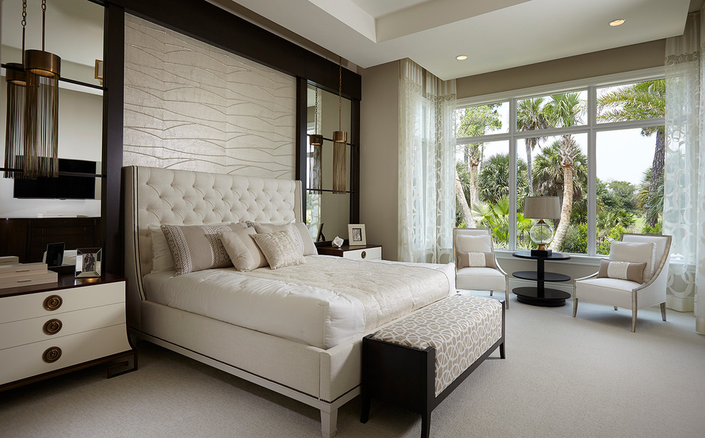 Large classic master bedroom in Miami with beige walls, carpet and feature lighting.