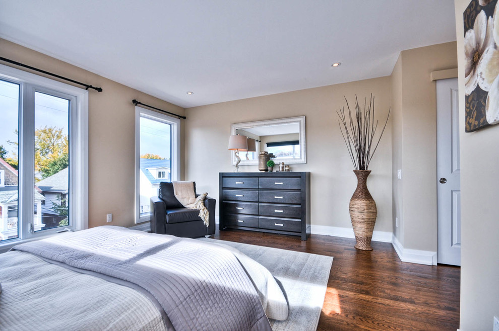 Design ideas for a medium sized classic master bedroom in Ottawa with beige walls, dark hardwood flooring and brown floors.