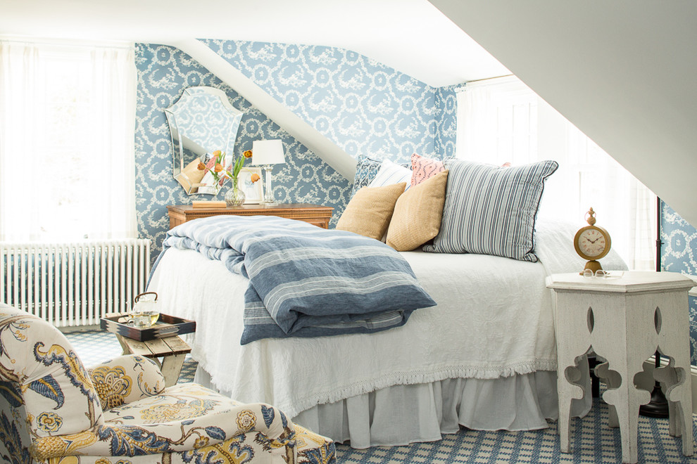 Country master bedroom in Portland Maine with blue walls and carpet.